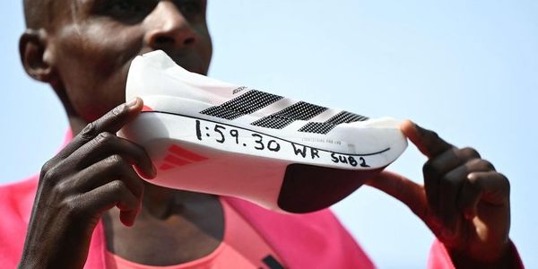 Marathon world record holder Sebastian Sawe with the winning shoe. (Photo: Adidas)
